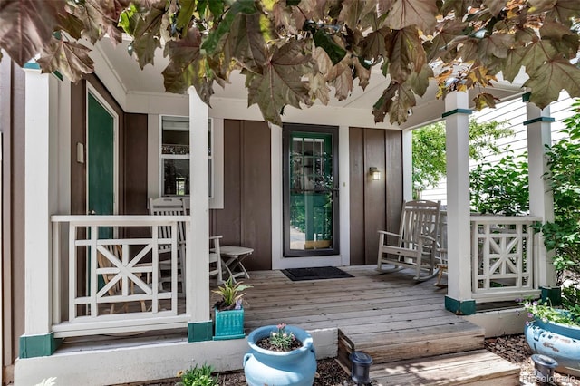 573 Entrada Dr, Golden, CO 80401 - property entrance featuring board and batten siding and a deck