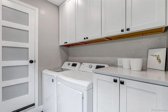 573 Entrada Dr, Golden, CO 80401 - washroom with cabinet space and washing machine and clothes dryer
