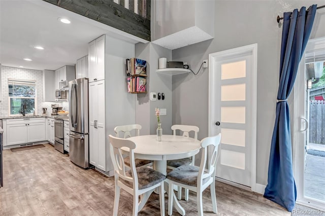 573 Entrada Dr, Golden, CO 80401 - dining space with healthy amount of natural light, light wood-style flooring, and recessed lighting