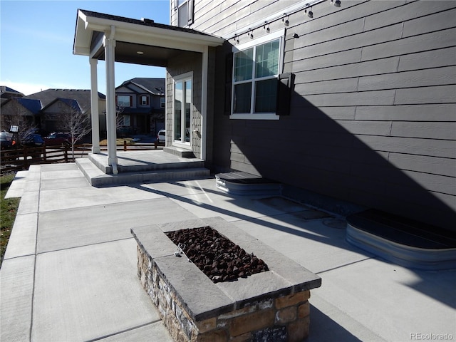 view of patio featuring a fire pit