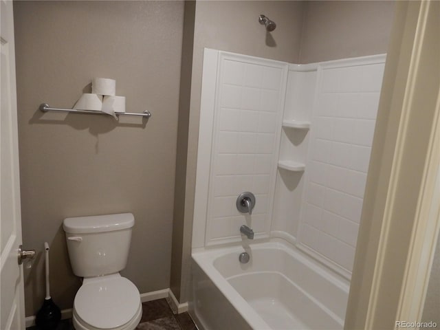 bathroom featuring toilet and shower / washtub combination