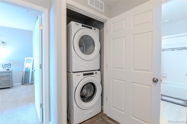 15700 E Jamison Dr Unit 8-103, Englewood, CO 80112 - washroom with stacked washer and clothes dryer