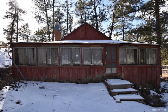 view of snow covered house