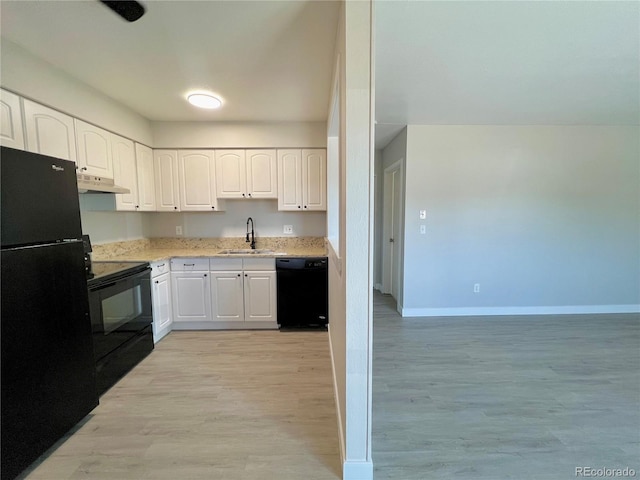 kitchen with white cabinetry, sink, black appliances, and light wood-type flooring