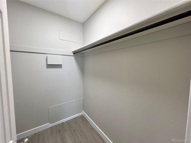 walk in closet featuring hardwood / wood-style floors