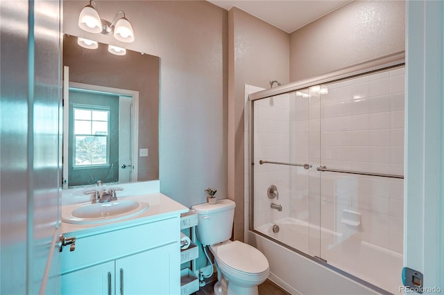 15619 Syracuse Way, Thornton, CO 80602 - full bath with a textured wall, vanity, and enclosed tub / shower combo