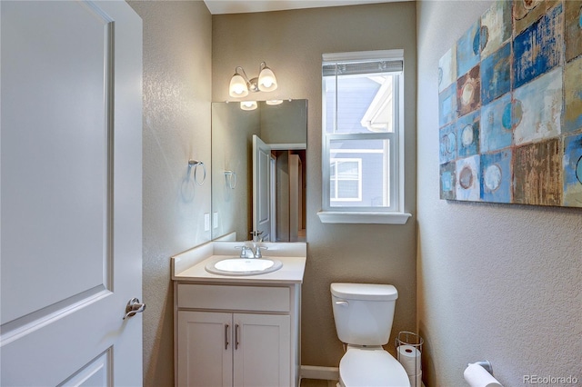 15619 Syracuse Way, Thornton, CO 80602 - half bath featuring vanity and a textured wall