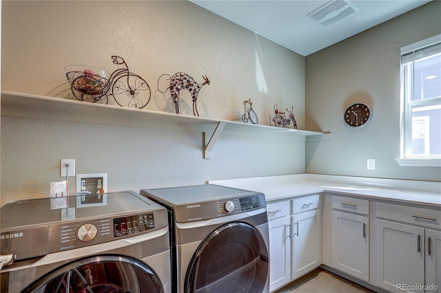 15619 Syracuse Way, Thornton, CO 80602 - washroom with separate washer and dryer and cabinet space