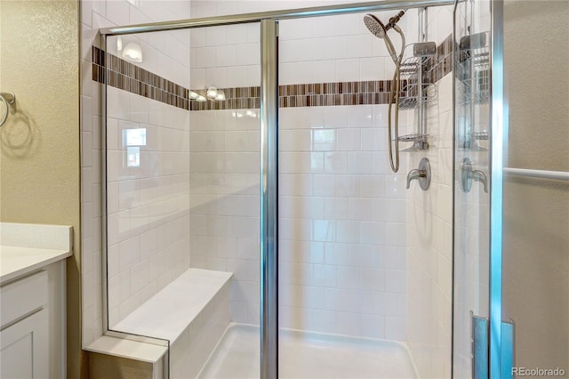 15619 Syracuse Way, Thornton, CO 80602 - bathroom featuring a textured wall, a stall shower, and vanity