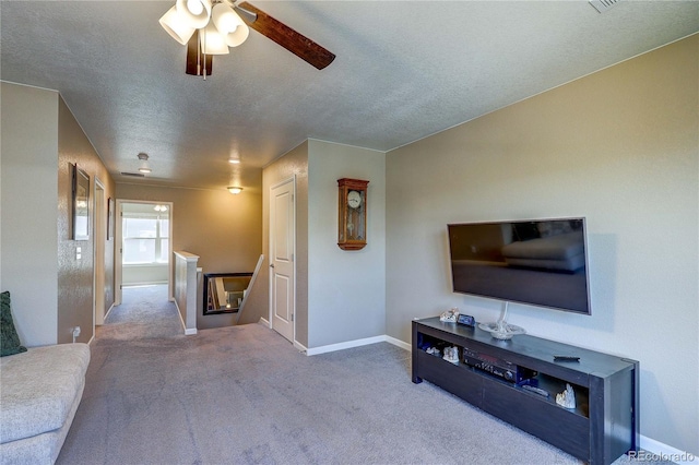 15619 Syracuse Way, Thornton, CO 80602 - living room featuring carpet flooring, ceiling fan, and a textured ceiling