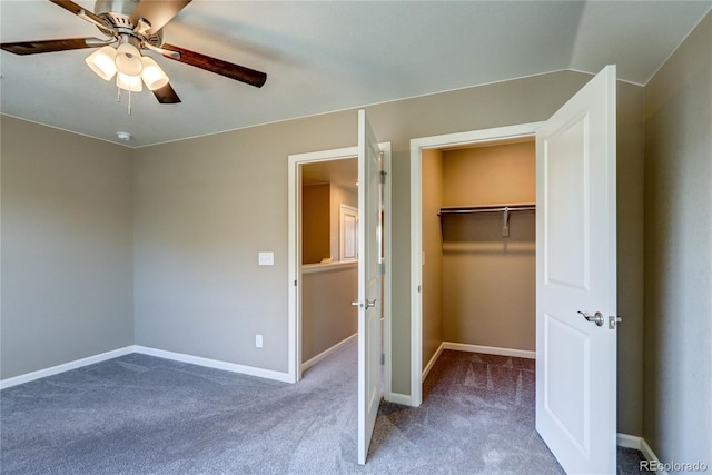 15619 Syracuse Way, Thornton, CO 80602 - unfurnished bedroom featuring carpet flooring, a walk in closet, ceiling fan, and a closet