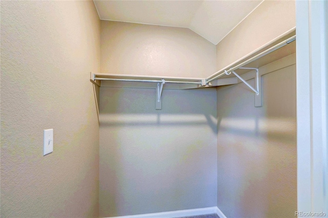 15619 Syracuse Way, Thornton, CO 80602 - walk in closet featuring vaulted ceiling