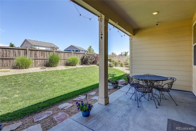 15619 Syracuse Way, Thornton, CO 80602 - fenced backyard featuring a patio area and outdoor dining space