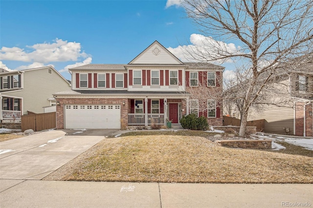 view of front of home featuring concrete driveway, an attached garage, fence, a porch, and brick siding