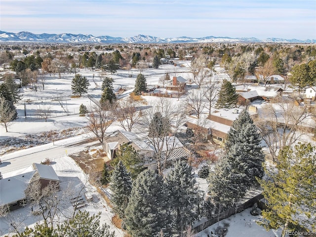 snowy aerial view featuring a mountain view