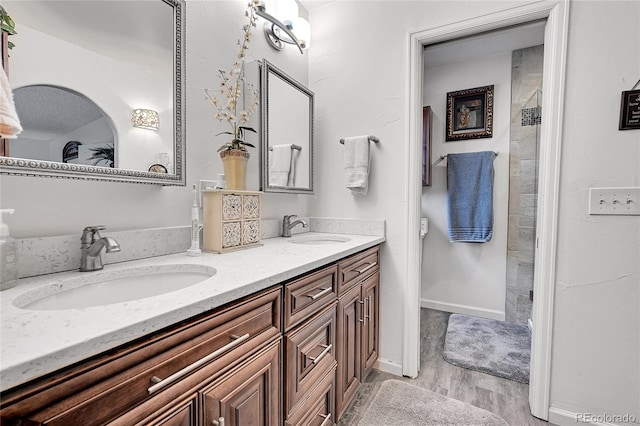 bathroom featuring vanity and wood-type flooring