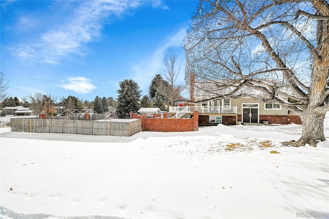 view of yard layered in snow