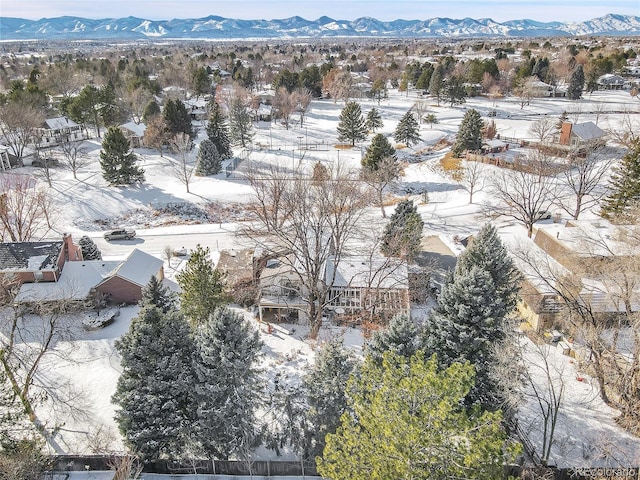 snowy aerial view with a mountain view