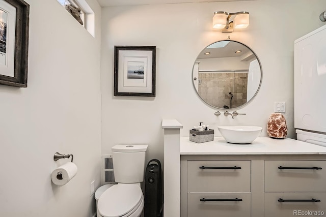 full bathroom featuring vanity and toilet