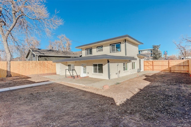 rear view of property with a patio