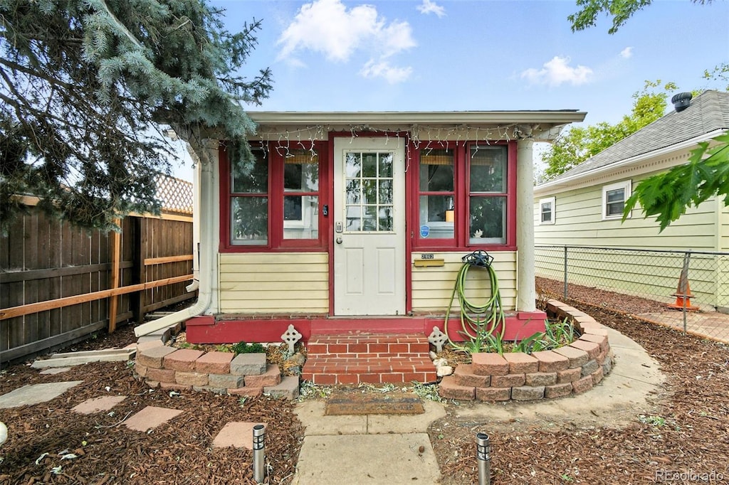 2962 S Galapago St, Englewood, CO 80110 - view of outdoor structure featuring entry steps and a fenced backyard