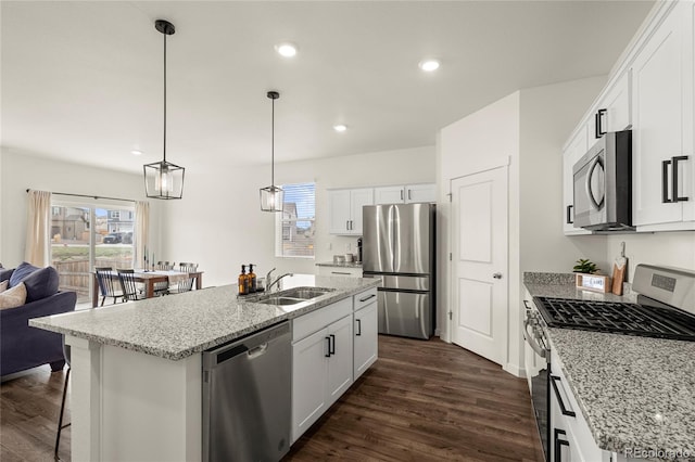 2326 Monte Vista St, Fort Lupton, CO 80621 - kitchen with stainless steel appliances, a sink, dark wood finished floors, plenty of natural light, and recessed lighting
