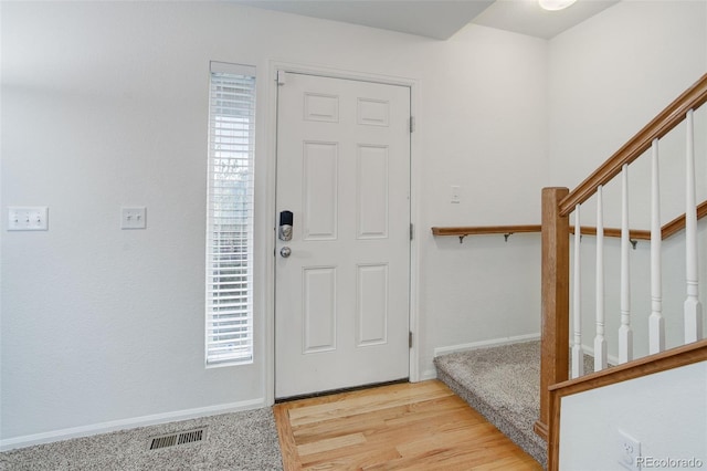 25812 E Cedar Pl, Aurora, CO 80018 - entrance foyer with stairway, baseboards, and wood finished floors