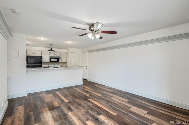 unfurnished living room featuring baseboards, a ceiling fan, and dark wood-style floors