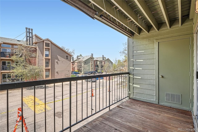 balcony with visible vents and a residential view
