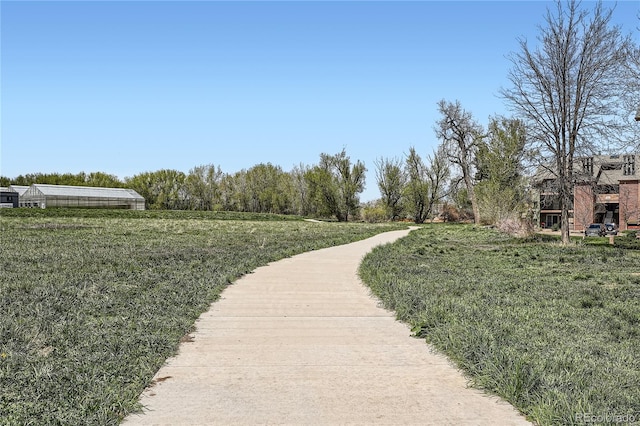 view of home's community featuring a yard