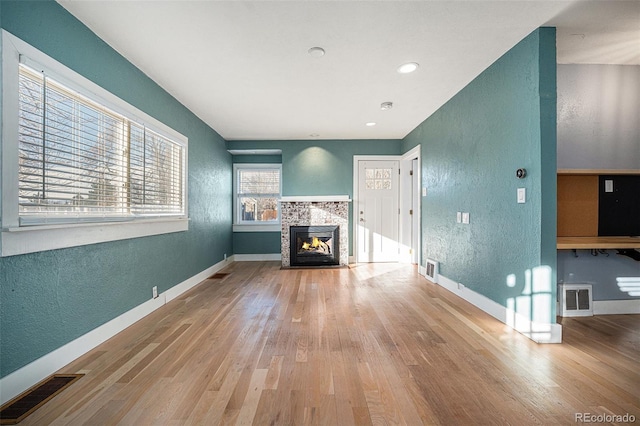 unfurnished living room with hardwood / wood-style flooring