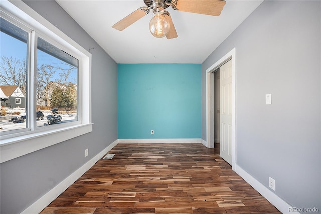 interior space featuring dark hardwood / wood-style floors and ceiling fan