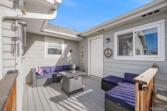 wooden terrace featuring an outdoor hangout area