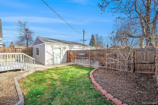 view of yard with an outbuilding and a deck