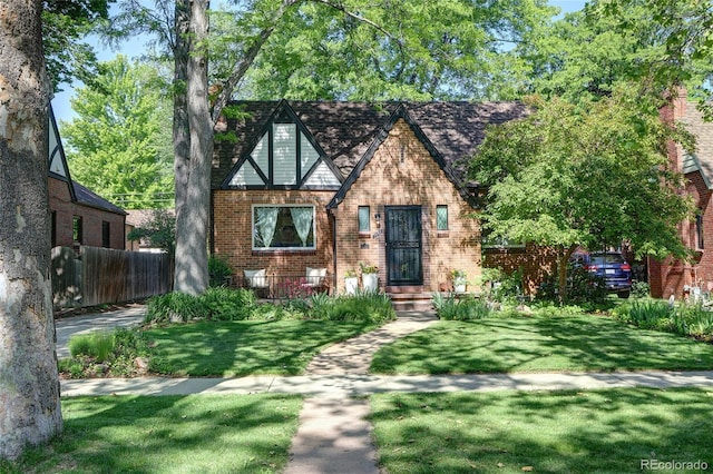 1661 Oneida St, Denver, CO 80220 - tudor house featuring brick siding