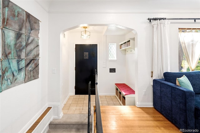 1661 Oneida St, Denver, CO 80220 - entrance foyer featuring arched walkways and tile patterned flooring