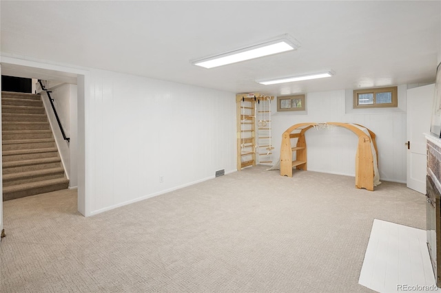 1661 Oneida St, Denver, CO 80220 - finished basement with light colored carpet and stairway