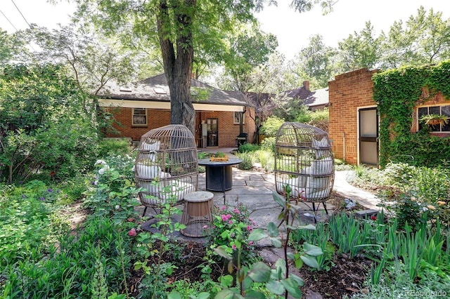 1661 Oneida St, Denver, CO 80220 - view of patio with a fire pit