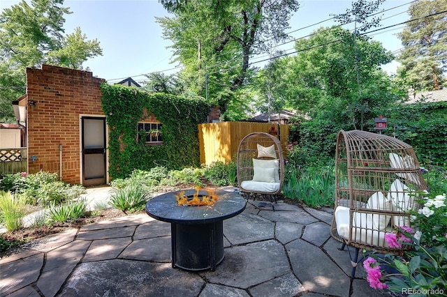 1661 Oneida St, Denver, CO 80220 - view of patio with a fire pit