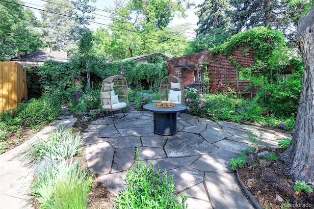 1661 Oneida St, Denver, CO 80220 - view of patio / terrace featuring a fire pit
