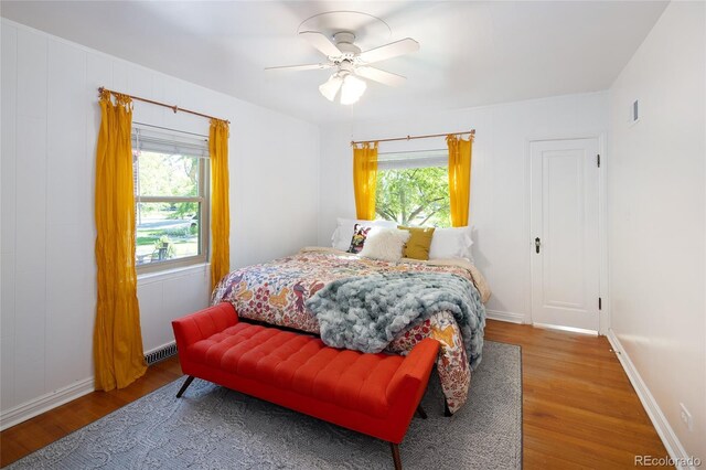 1661 Oneida St, Denver, CO 80220 - bedroom featuring wood finished floors and a ceiling fan