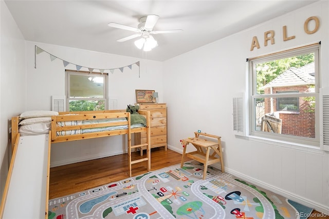 1661 Oneida St, Denver, CO 80220 - bedroom featuring wood finished floors and a ceiling fan