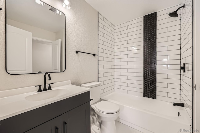 full bathroom with vanity, toilet, and tiled shower / bath combo