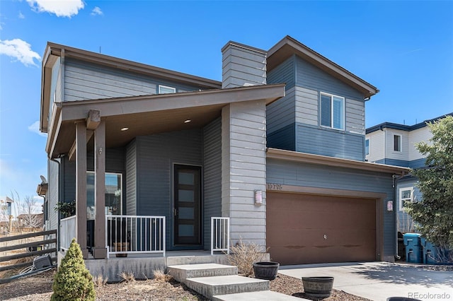 10796 Truckee Cir, Commerce City, CO 80022 - modern home with a garage, a chimney, fence, and driveway