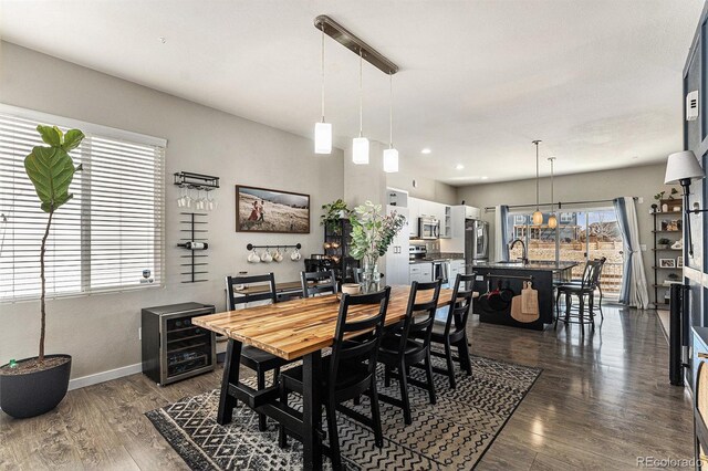 10796 Truckee Cir, Commerce City, CO 80022 - dining space with dark wood-type flooring, baseboards, and recessed lighting