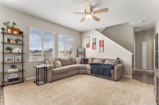 10796 Truckee Cir, Commerce City, CO 80022 - living area with carpet flooring, stairway, a ceiling fan, and baseboards