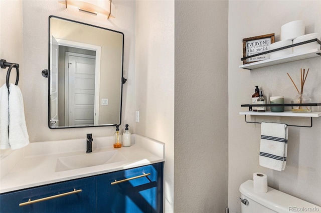 10796 Truckee Cir, Commerce City, CO 80022 - bathroom with toilet, vanity, and a textured wall