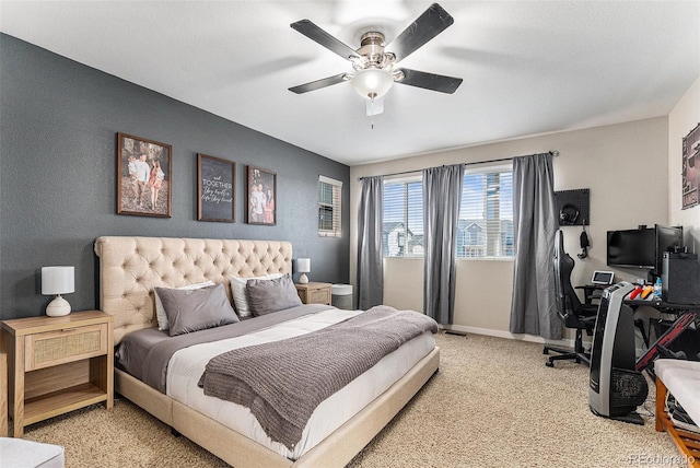 10796 Truckee Cir, Commerce City, CO 80022 - bedroom with a desk, light colored carpet, baseboards, and ceiling fan