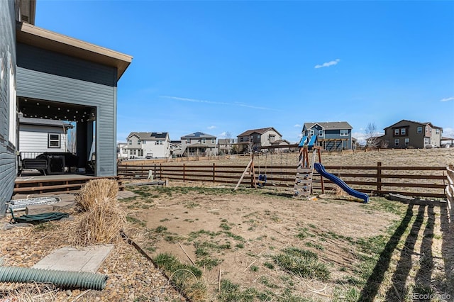 10796 Truckee Cir, Commerce City, CO 80022 - fenced backyard with a playground and a residential view