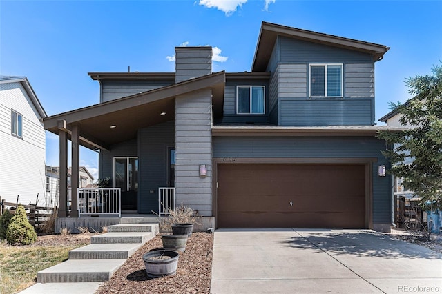 10796 Truckee Cir, Commerce City, CO 80022 - view of front of property with covered porch, a garage, driveway, and a chimney